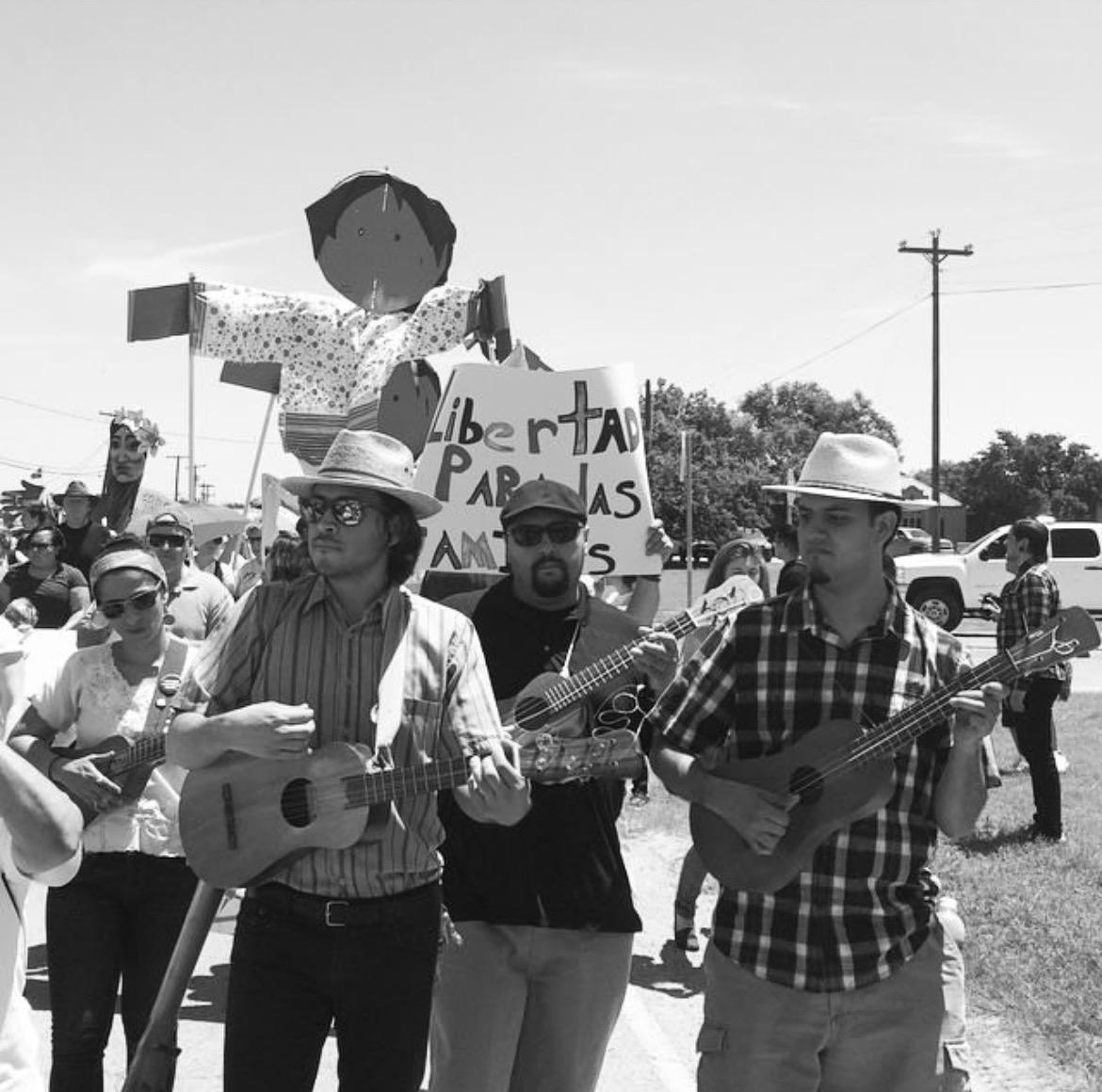 Musicians-at-the-Dilley-Detention-Center-Protest-in-Dilley-Texas-in-2017.-Image-Credit-Jamila-Hammami Musicians-at-the-Dilley-Detention-Center-Protest-in-Dilley-Texas-in-2017.-Image-Credit-Jamila-Hammami